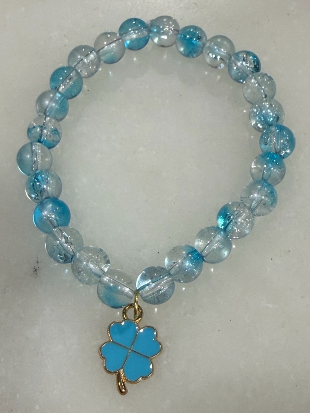 Blue Beaded Stretch Bracelet with Gold Clover Charm